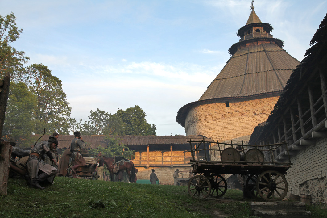 Soldiers and horses at the Intercession Wall in Pskov